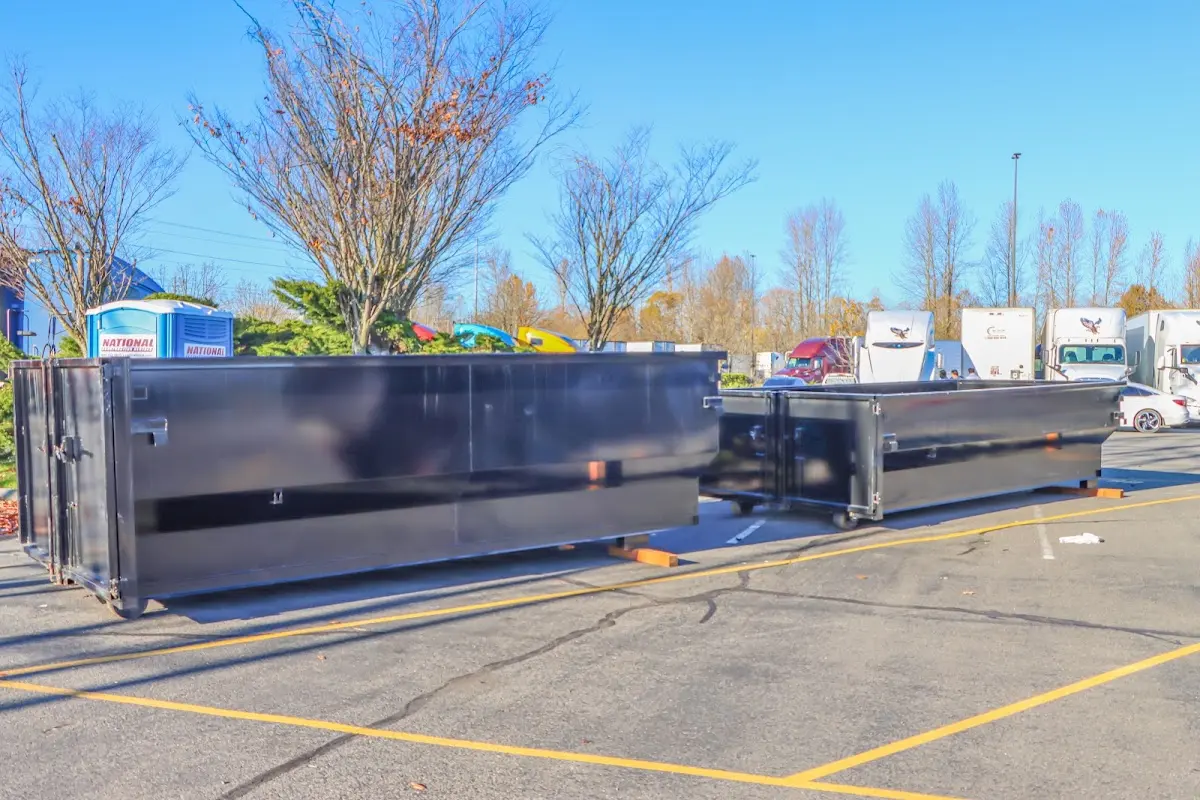 Professional dumpster rental service with roll-off container on residential driveway in Wentzville